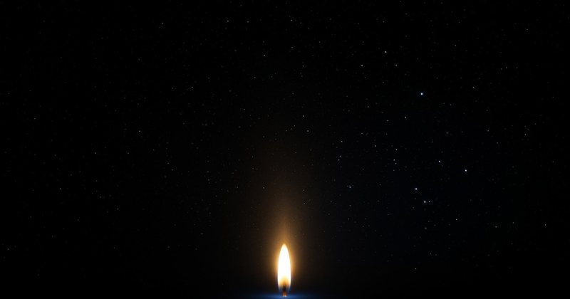 Share card for Light Cone: a single candle flame glowing in a dark starfield.